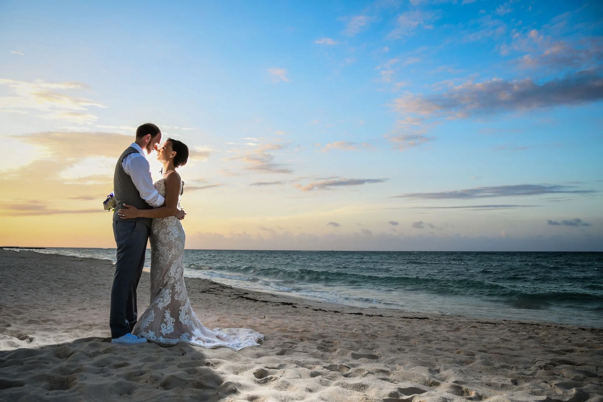 Wedding couple at sunset beach